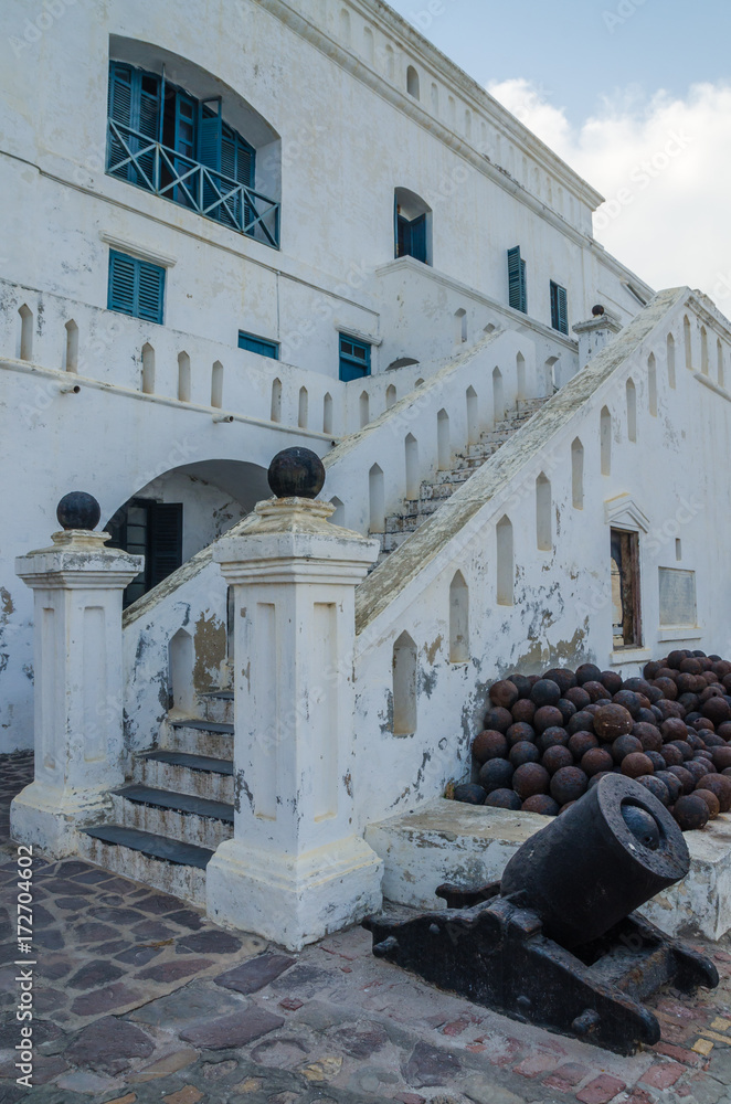 Famous slave trading fort of colonial times Cape Coast Castle with old cannons and white washed walls, Ghana, Africa