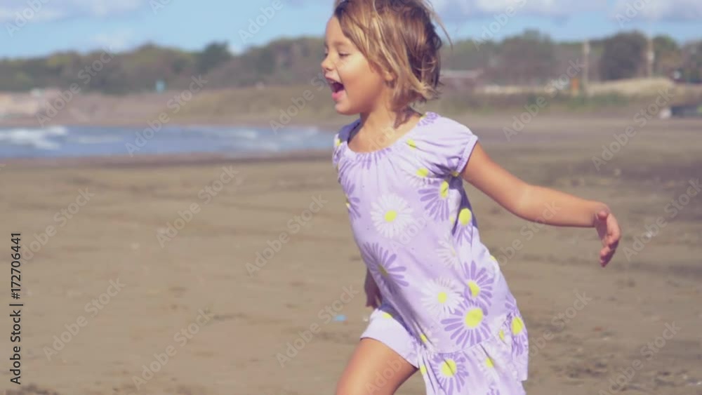 Mother and daughter playing on beach happy in autumn super slow motion closeup retro style Mother and daughter playing on beach happy in autumn super slow motion closeup retro style