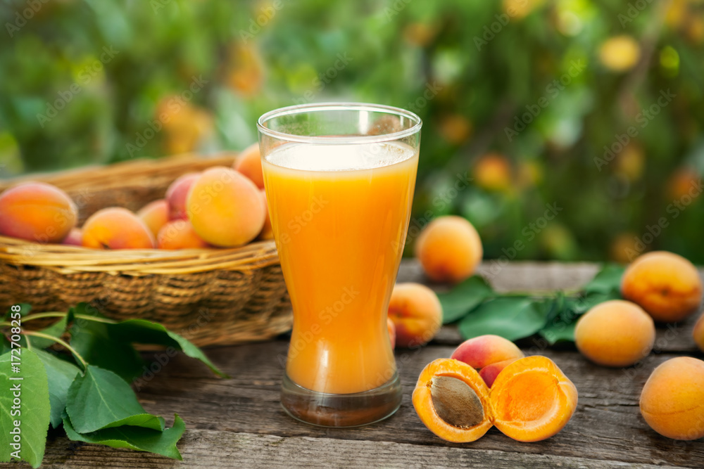 Glass with apricot juice.Fresh drink from apricots. Glass with apricot juice.Fresh drink from apricots.