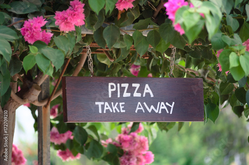 Wooden pizza take away sign board outside