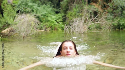 Teenager bathing in a natural area called Batán de Bogarra. photo