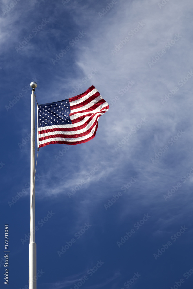 American flag on the blue sky