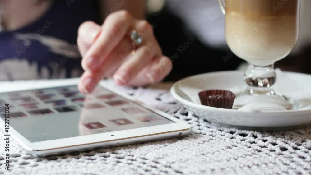 Girl With Tablet In Cafe