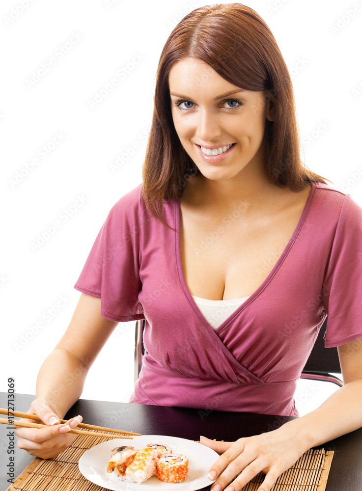 Beautiful woman eating sushi roll, over white Beautiful woman eating sushi roll, over white