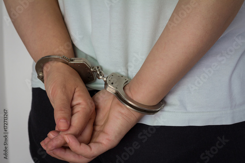 Women criminal in handcuffs arrested for crimes