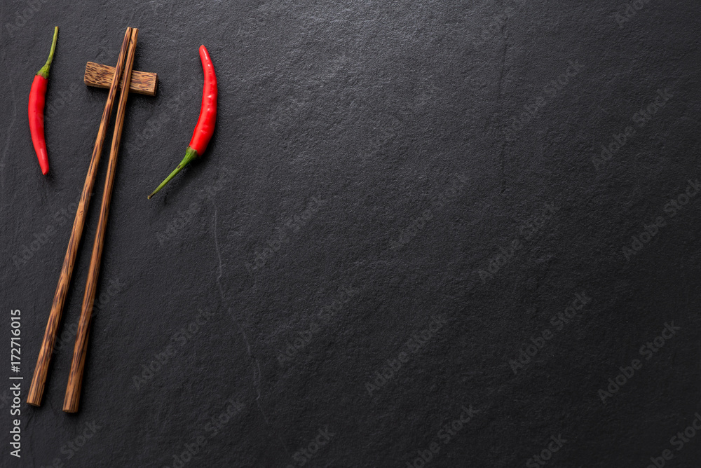 space chopstick with chili and vegetable on dark background
space chopstick with chili and vegetable on dark background