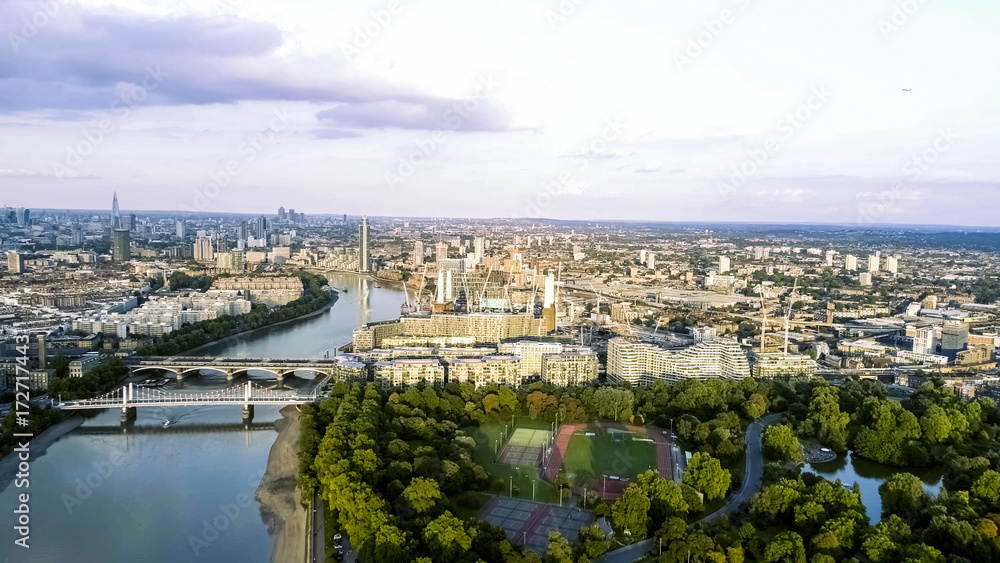 Aerial View of Battersea Power Station and Battersea Park feat. Running Tracks and Fields, Chelsea Bridge, Thames River in London 4K