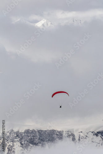 The paraglider flying in mountains the resort of Gudauri Georgia