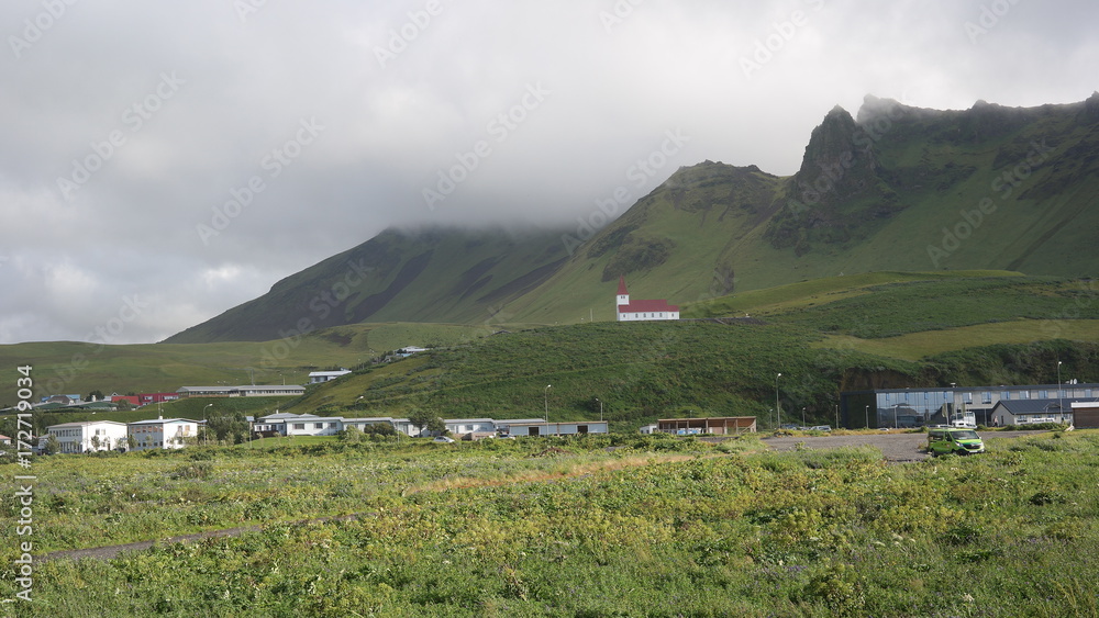 Vík village in the south of Iceland and mountain sorrounding