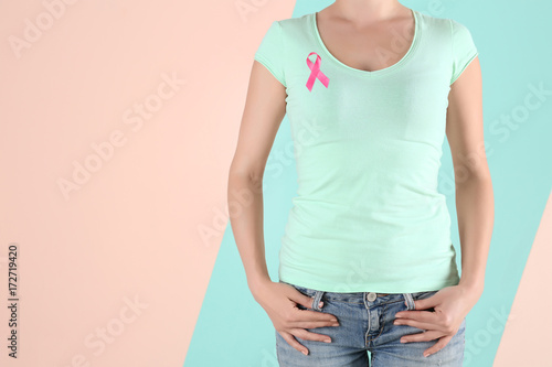 Young woman in mint t-shirt on color background