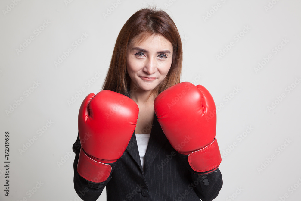Young Asian woman with red boxing gloves. Young Asian woman with red boxing gloves.