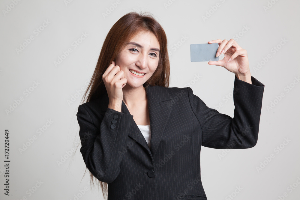 Happy young Asian woman with a blank card. Happy young Asian woman with a blank card.