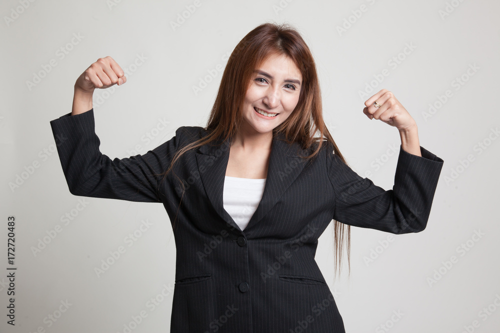 Beautiful young Asian woman flex bicep. Beautiful young Asian woman flex bicep.