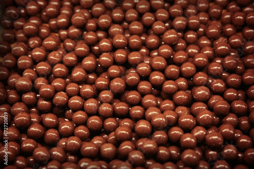 Closeup of chocolate dragees as background