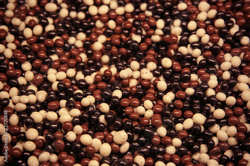 Closeup of chocolate dragees as background