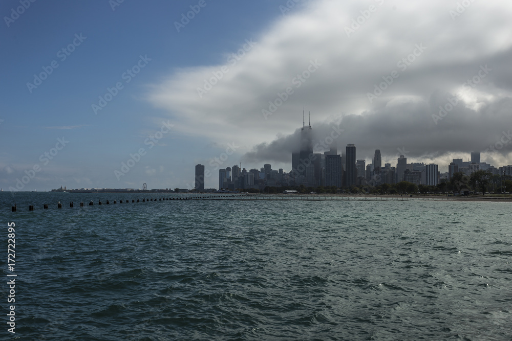 Chicago skyline with lake and clouds