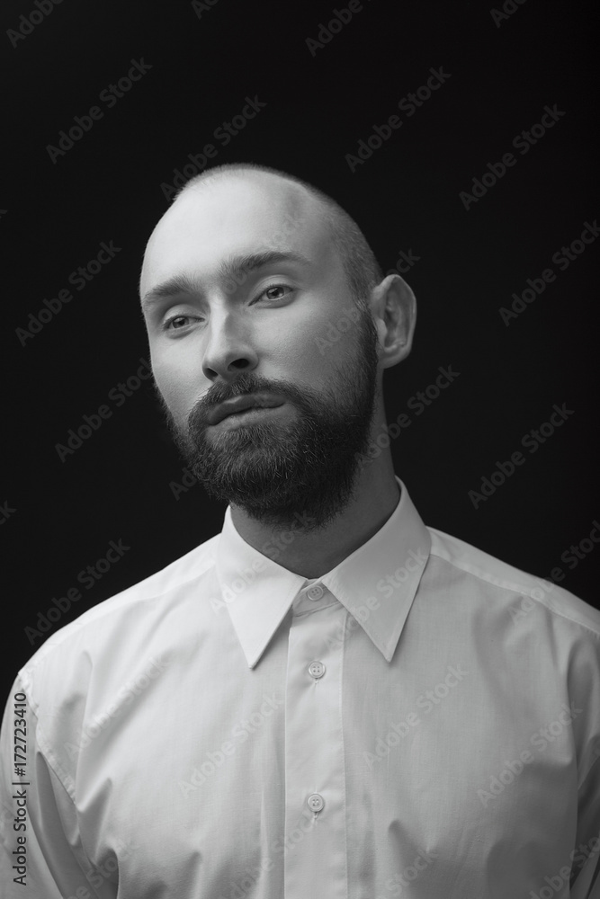Fototapeta premium young white beard man white shirt black pants studio monochrome background