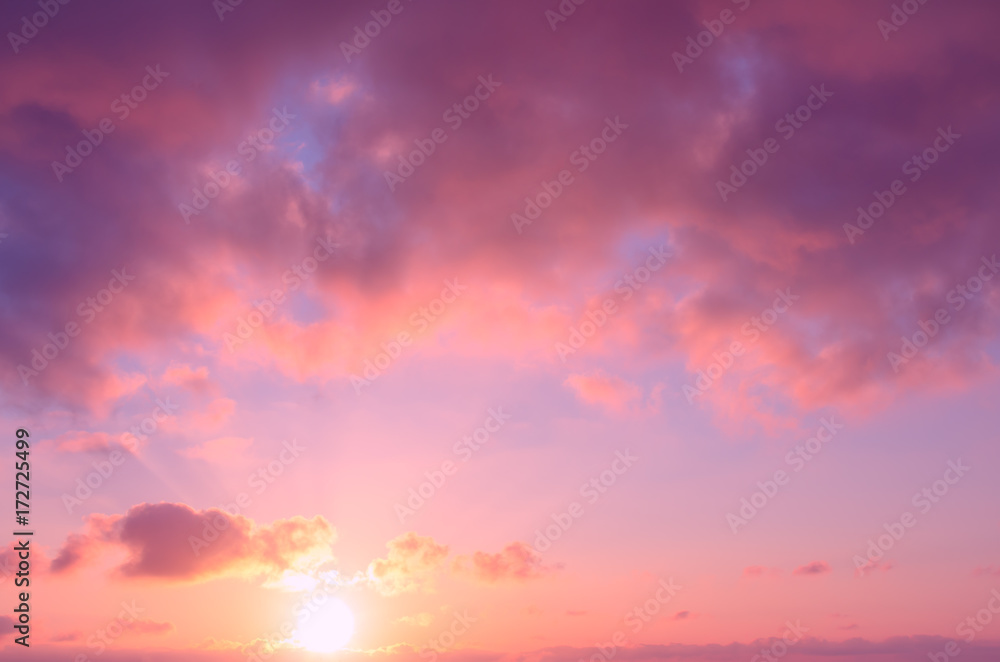 Obraz premium Romantic gentle pink sunset in the sky in summer.