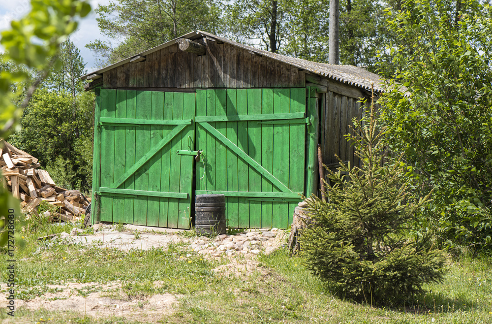 wooden shed with bright green gates wooden shed with bright green gates