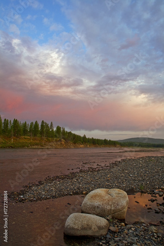 Sunset on the rocky river. River Omulevka, Magadan region photo