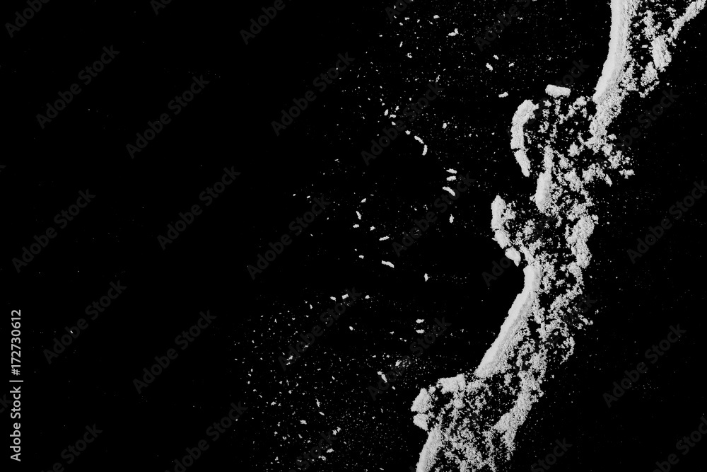 Fototapeta premium White powder isolated on black background, top view
