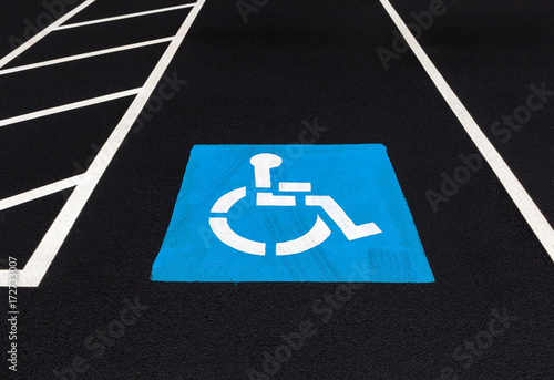 Handicap parking spot on black pavement