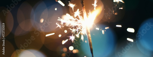 Photos Night background with a sparkler