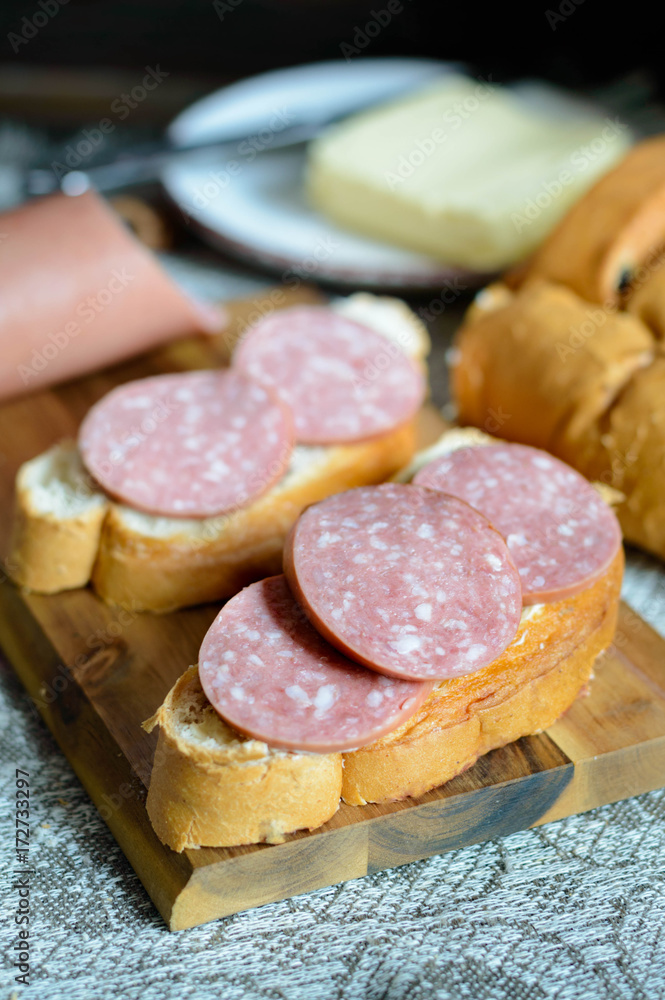 bologna sausage on piece of bread