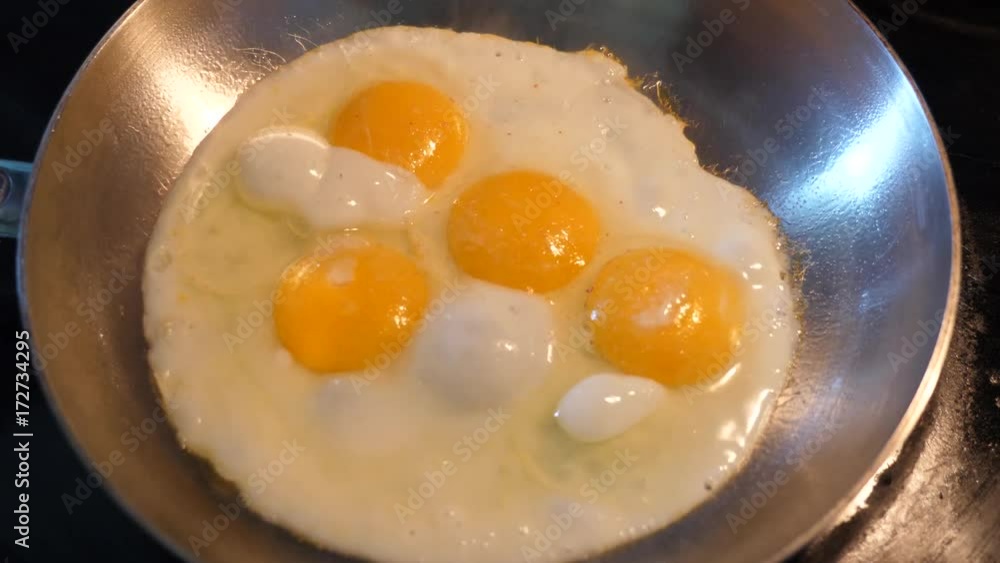 Salting eggs in a pan Salting eggs in a pan