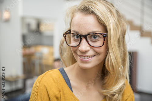 Portrait of beautiful blond woman with eyeglasses
