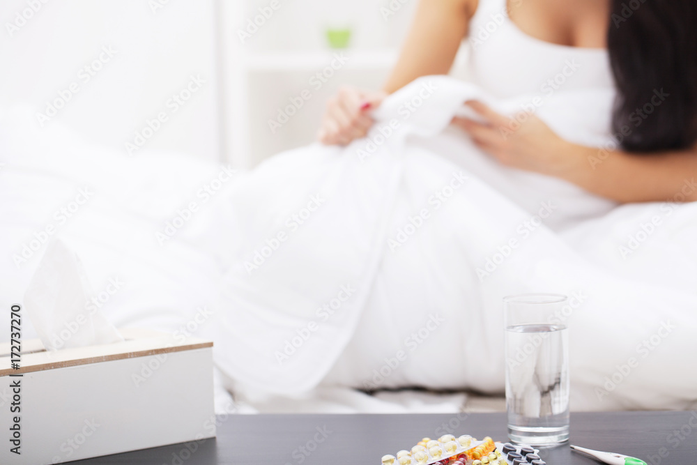 Cold And Flu. Portrait Of Ill Woman Caught Cold, Feeling Sick And Sneezing In Paper Wipe. Closeup Of Beautiful Unhealthy Girl Covered In Blanket Wiping Nose. Healthcare Concept. High Resolution Cold And Flu. Portrait Of Ill Woman Caught Cold, Feeling Sick And Sneezing In Paper Wipe. Closeup Of Beautiful Unhealthy Girl Covered In Blanket Wiping Nose. Healthcare Concept. High Resolution