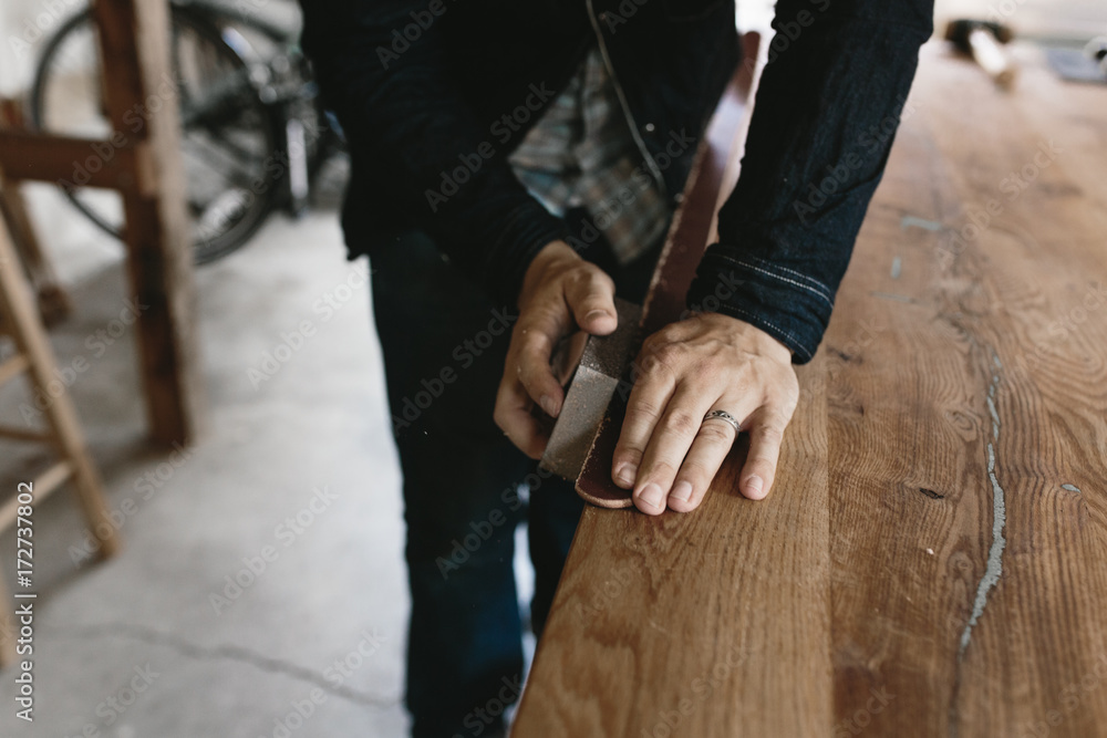 detail of belt being made on table