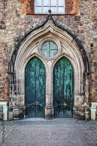 Neogothic Entrance with Two Copper Doors photo