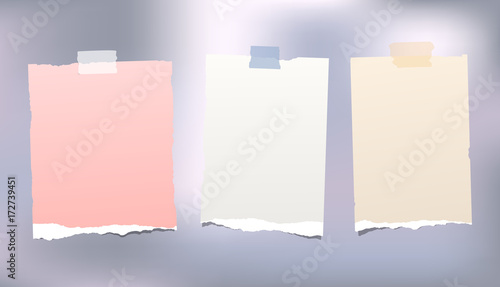 Note, notebook, copybook paper strips stuck with sticky tape on colorful background.