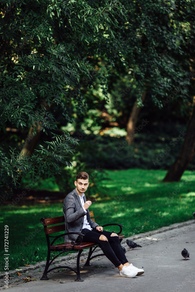 Man sitting on the park background Man sitting on the park background