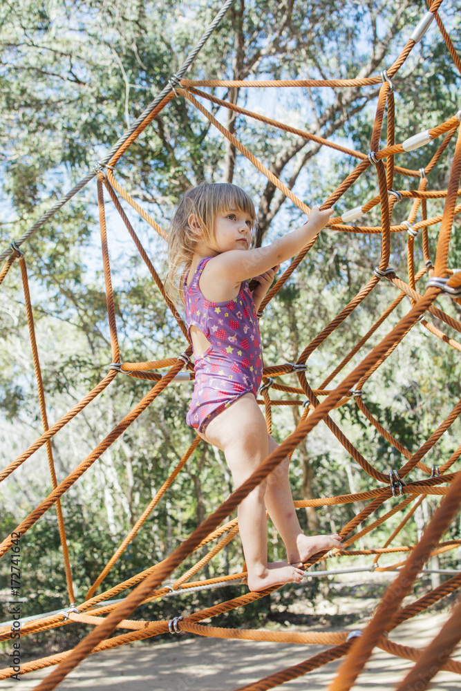 Little girl playing on outdoor playground Little girl playing on outdoor playground