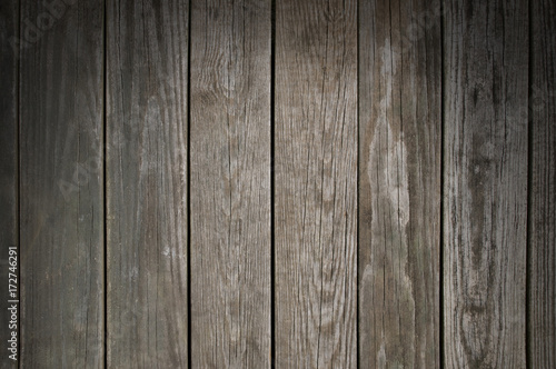 Weathered wooden planking background lit from above