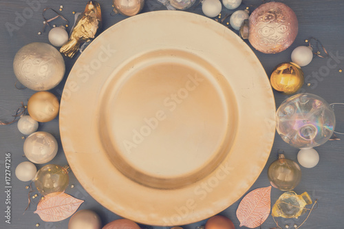 Christmas empty golden plate with gold decorations, retro toned