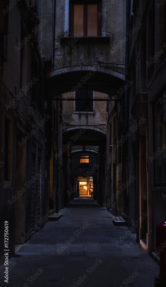 Spooky back alley during evening hours.Italy Spooky back alley during evening hours.Italy