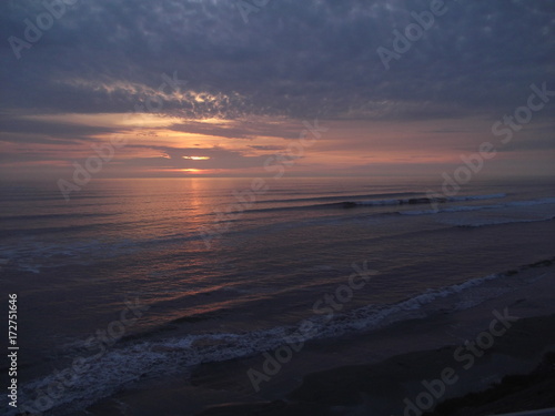 Atardecer frente al mar en la ciudad de Chancay, Perú. photo