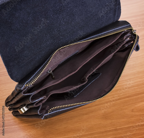 open man's bag; empty male brown clutch
