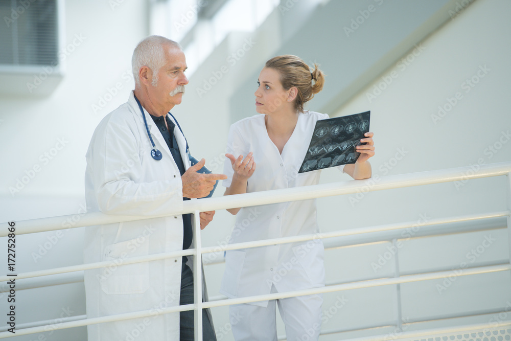 a doctor and a nurse talking a doctor and a nurse talking