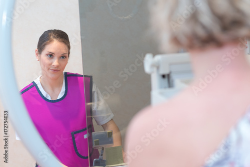 female doctor assisting patient during mammogram