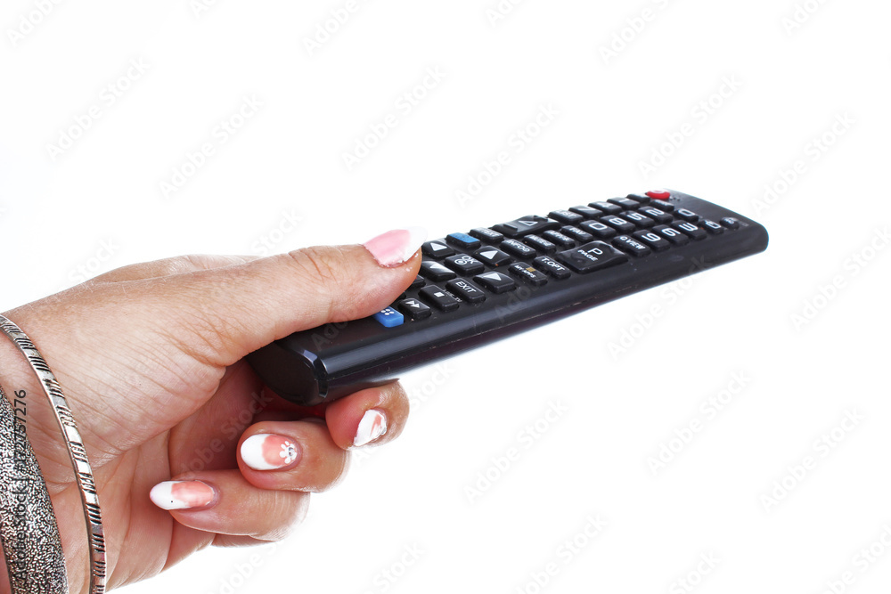 Woman hand holding remote control on isolated white cutout background. Studio photo with studio lighting easy to use for every concept. Woman hand holding remote control on isolated white cutout background. Studio photo with studio lighting easy to use for every concept.
