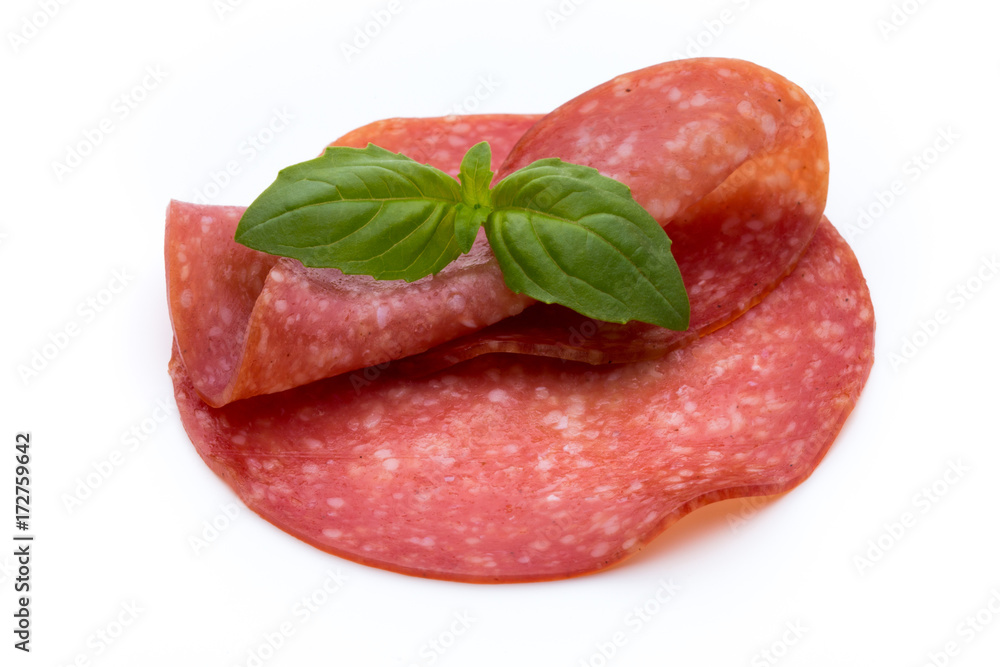 Salami slices isolated on white background. Salami slices isolated on white background.
