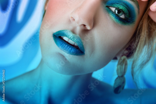 Young woman with bright mak...