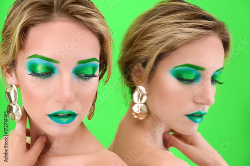 Young woman with bright gre...
