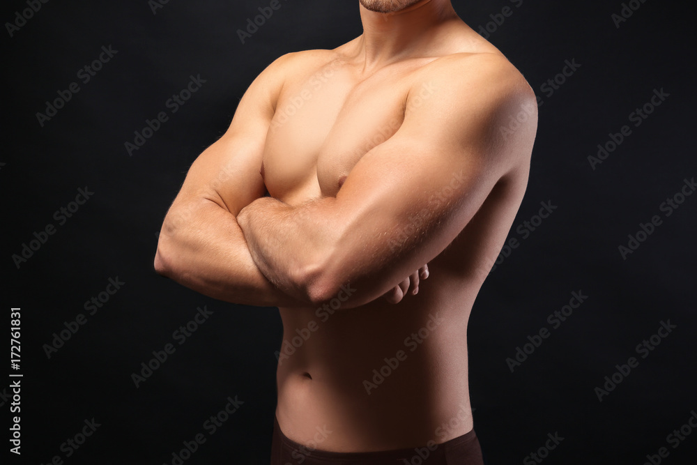 Sporty young man on dark background Sporty young man on dark background