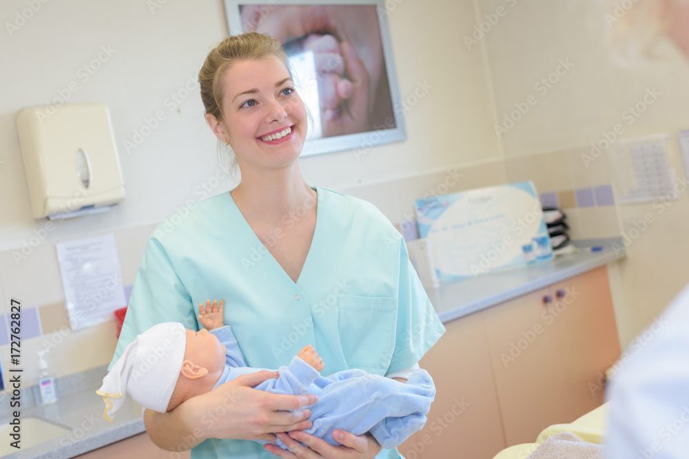 nurse holding new born at maternity nurse holding new born at maternity