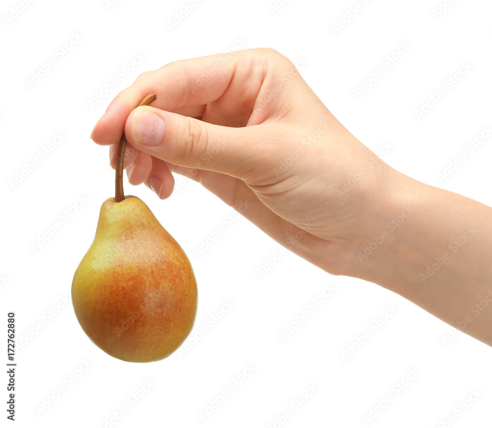 Hand of woman holding delicious ripe pear on white background Hand of woman holding delicious ripe pear on white background